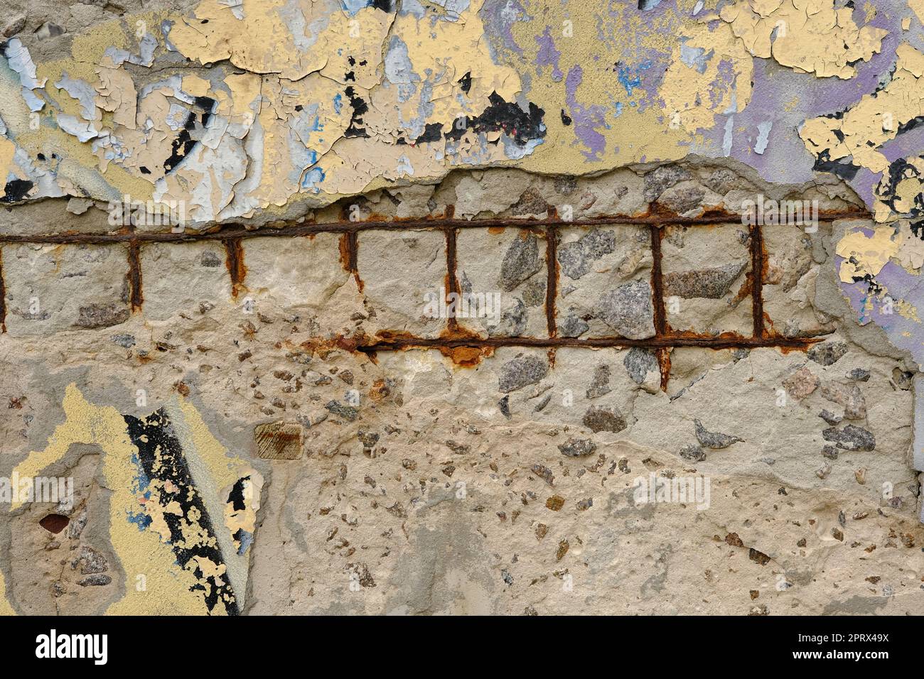 Old reinforced concrete structure with damaged and rusty metallic reinforcement that must be demolished - Metal bars rusty due to water infiltration into concrete Stock Photo