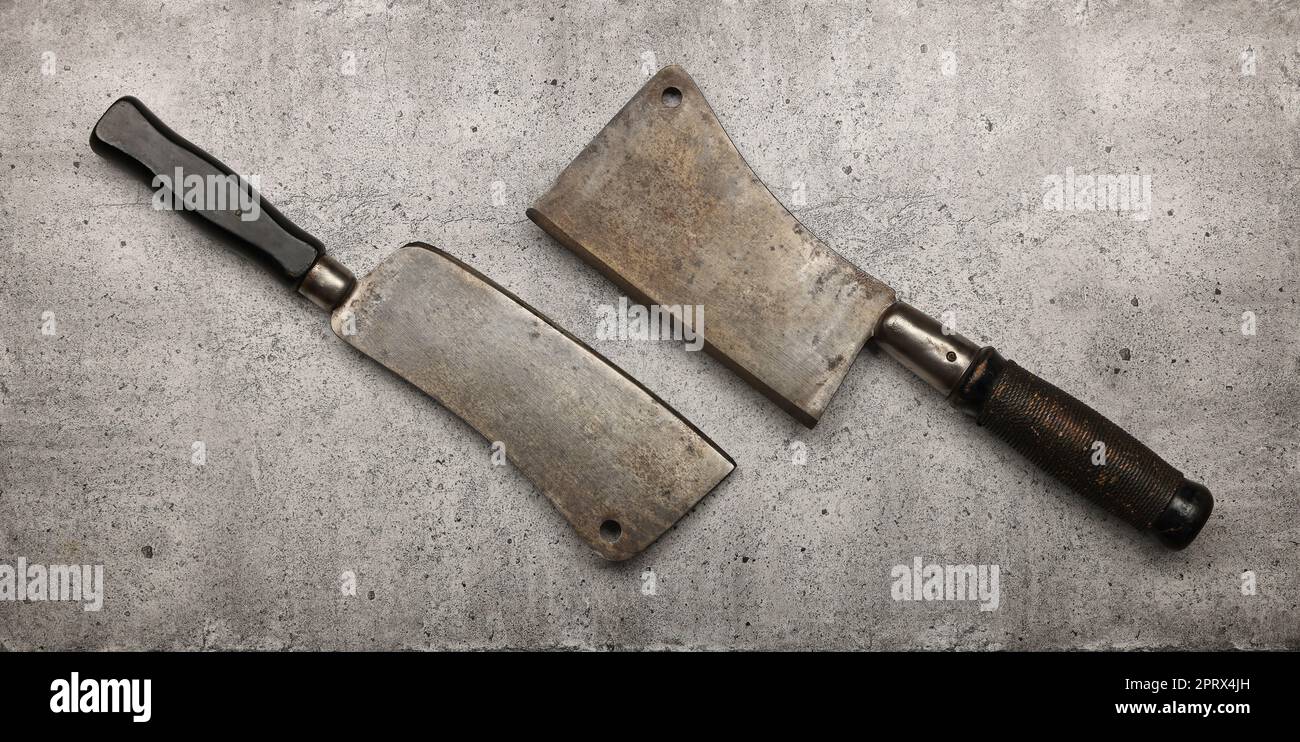 Two vintage butcher meat cleavers on table Stock Photo Alamy