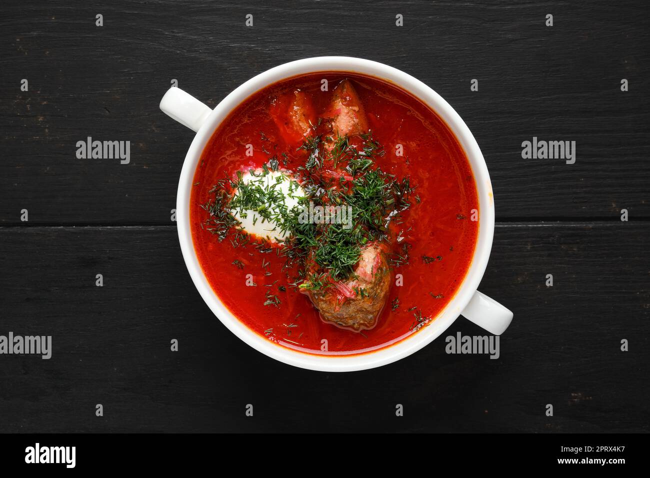 Overhead view of hot tomato soup with beef rib Stock Photo