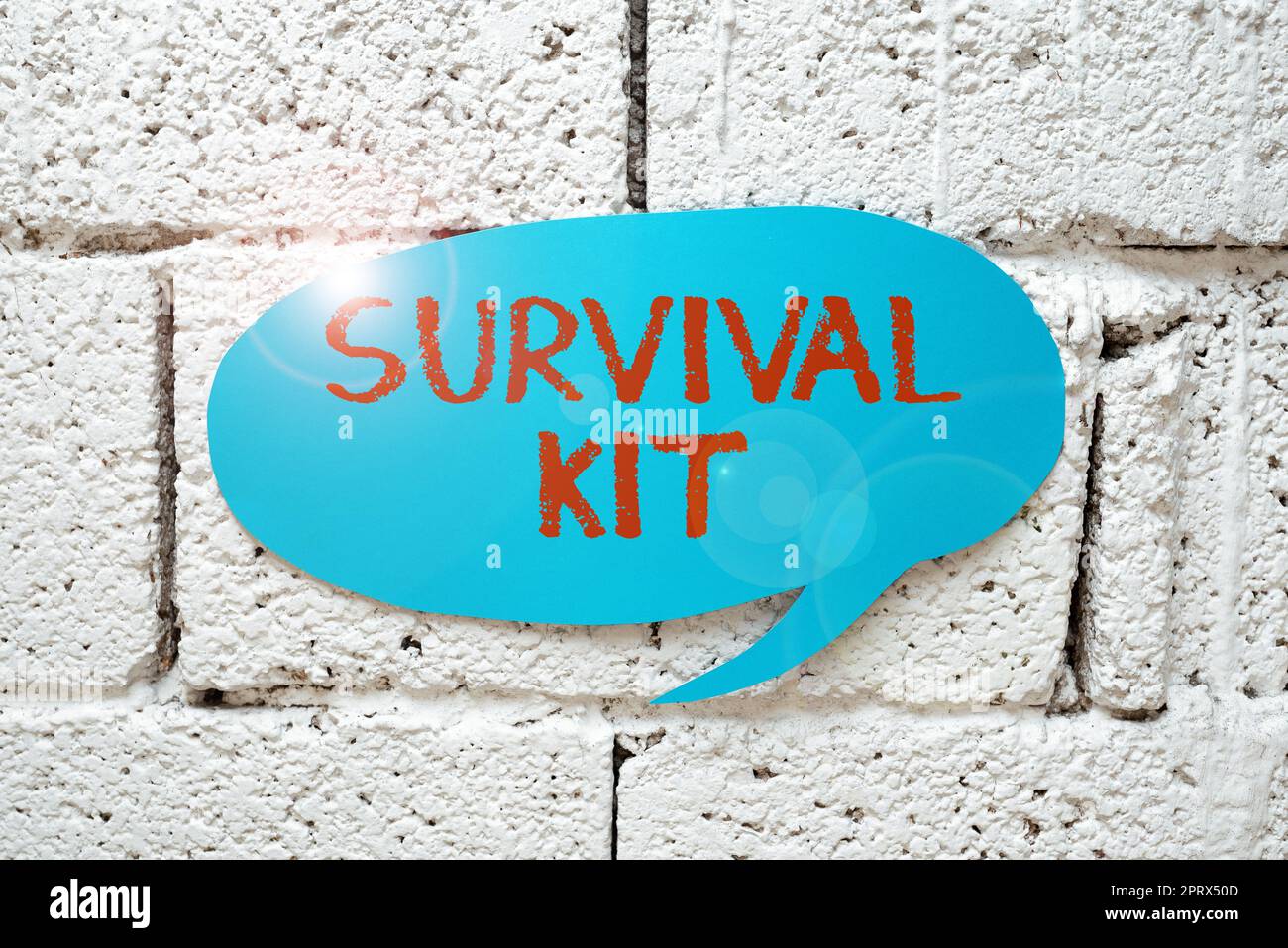 Hand writing sign Survival Kit. Business idea Emergency Equipment Collection of items to help someone Stock Photo