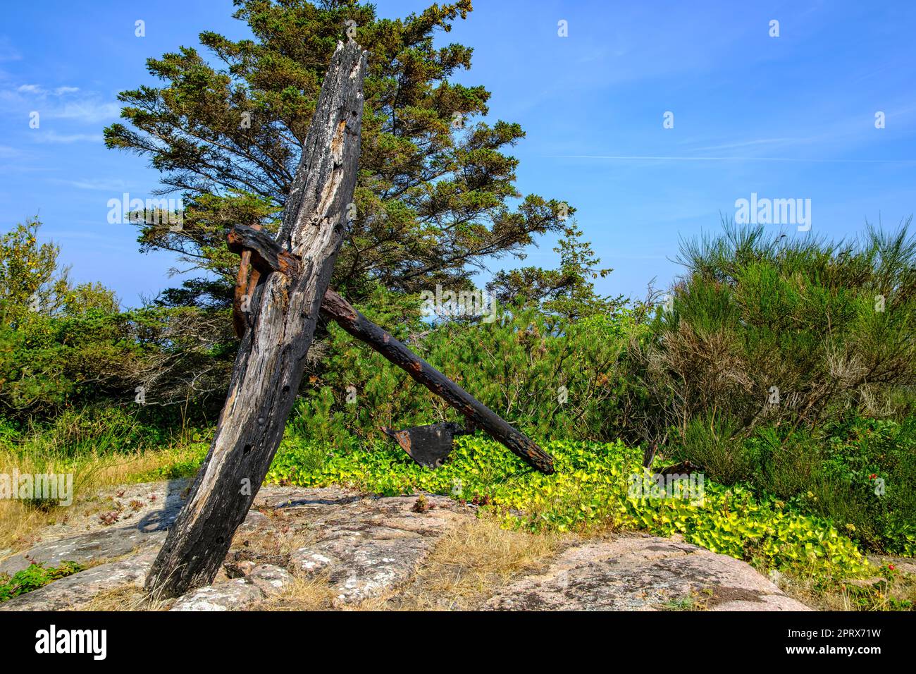 Old rusty and weathered ship anchor at Hammer Odde Lighthouse at the northern tip of Bornholm Island, Denmark, Scandinavia, Europe. Stock Photo