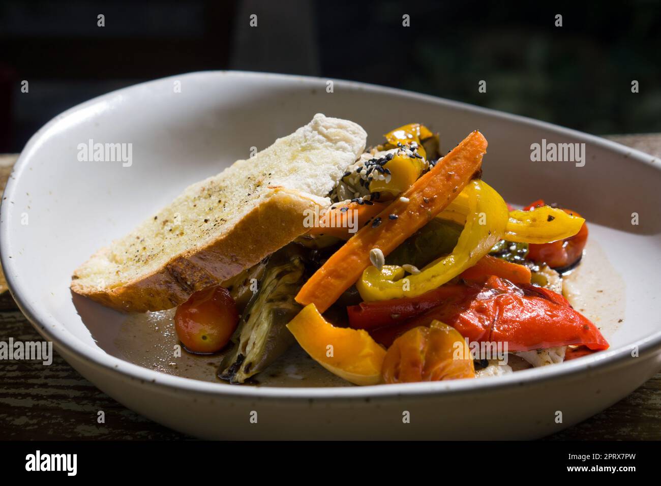 Grilled organic salad, served with black sesame dressing and Baguette ...