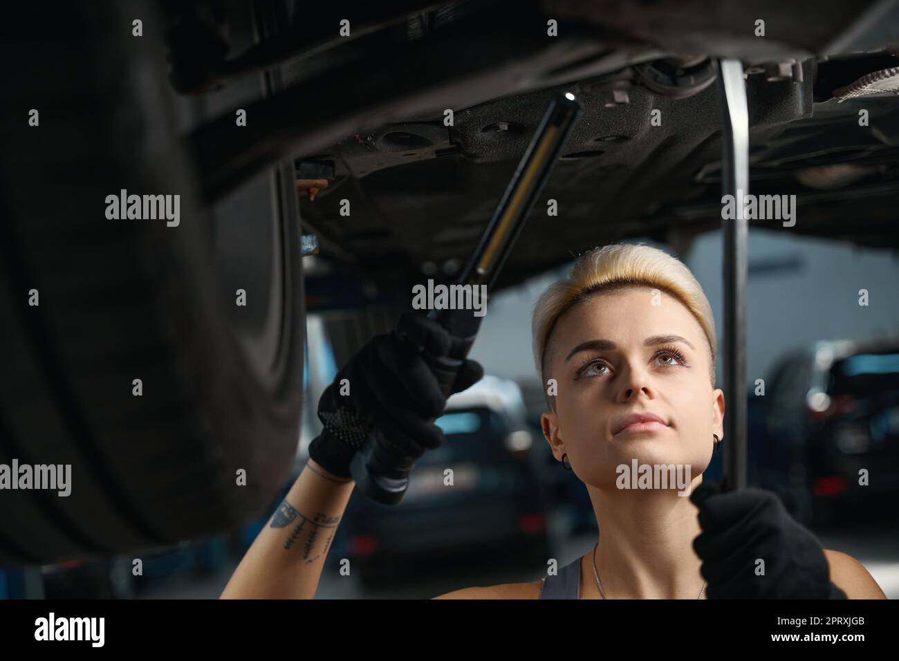 Mechanic adjusts wheel alignment car hi-res stock photography and ...
