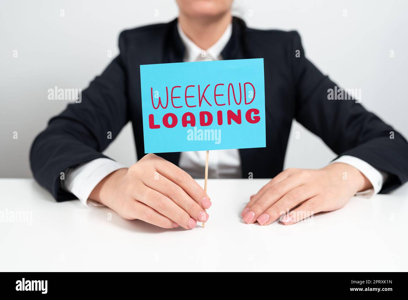 Sign displaying Weekend Loading, Business showcase Starting Friday ...