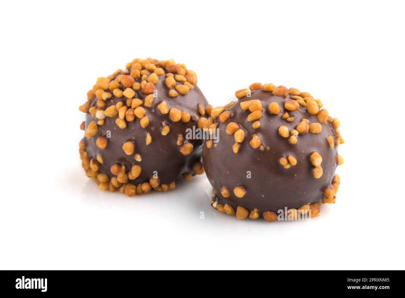 Chocolate caramel ball candies with almonds isolated on white