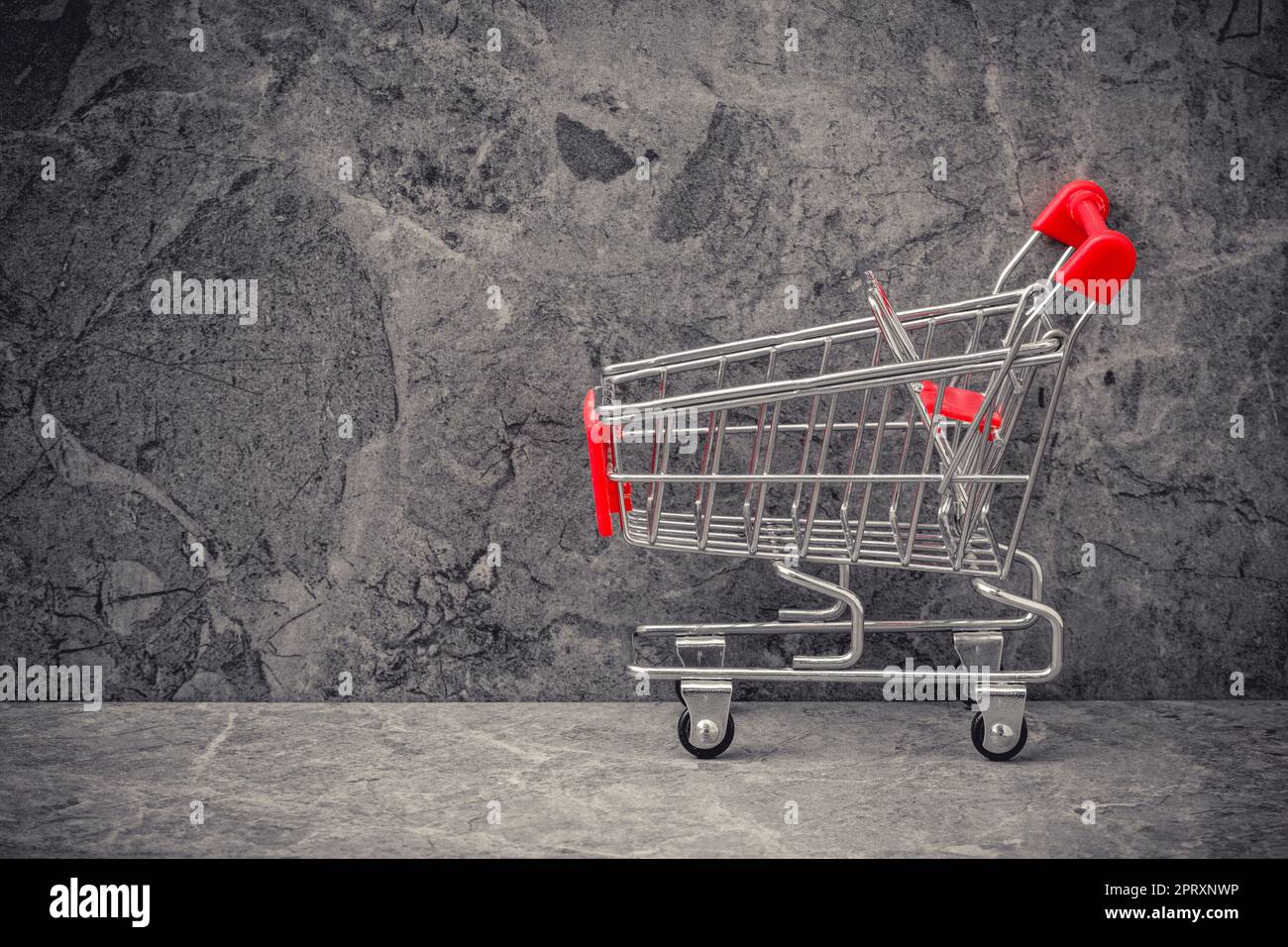 Side view of empty shopping cart or trolley .Copy space Stock Photo - Alamy