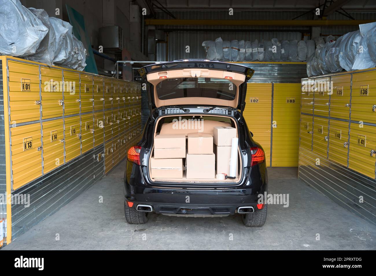 Car with an open trunk is in storage room Stock Photo Alamy