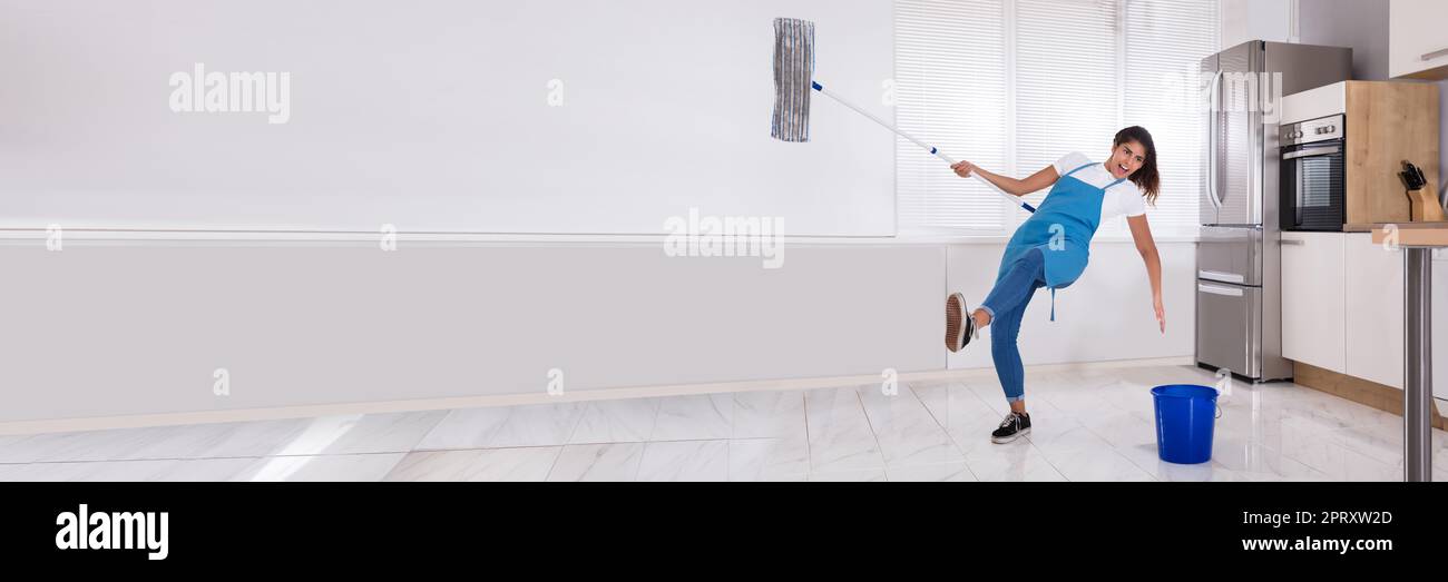 Cleaning Home Slip And Fall Accident. Mop House Floor Stock Photo