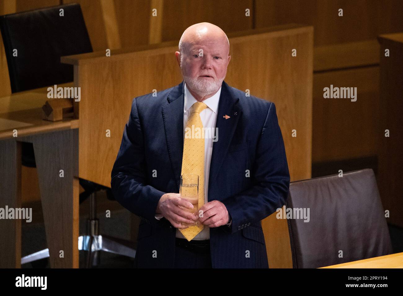 Edinburgh, Scotland, UK. 27th Apr, 2023. PICTURED: Colin Beattie MSP, Treasurer of the Scottish National Party (SNP). Weekly session of First Ministers Questions as Humza Yousaf MSP, First Minister of Scotland takes questions in the chamber. Scenes also inside the corridor before and after FMQs. Credit: Colin Fisher/Alamy Live News Stock Photo