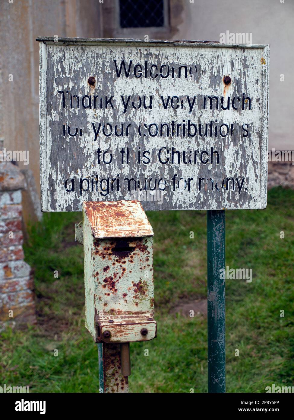 A money box outside a church in Suffolk Stock Photo