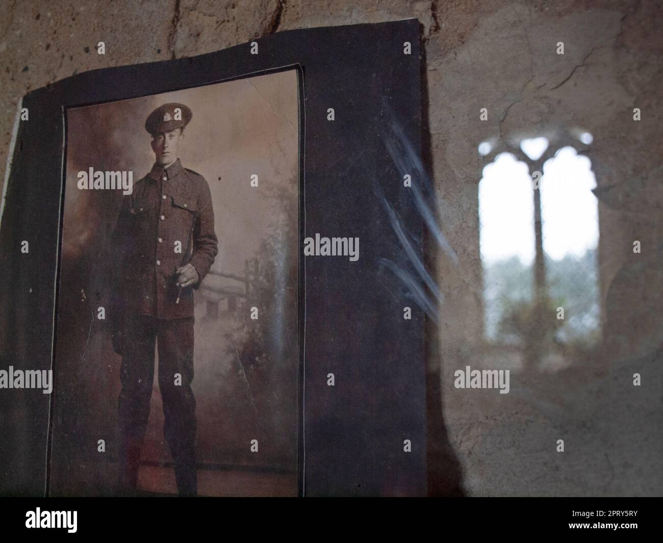 In a rural, Suffolk church hangs a photo of a young soldier from the First World War Stock Photo