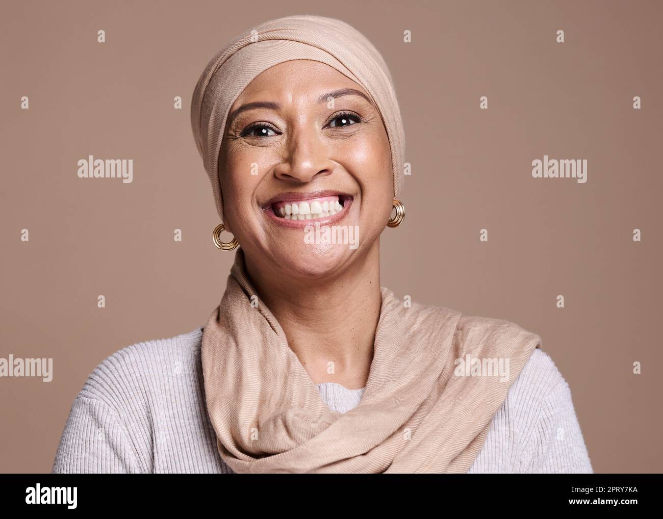 Muslim, portrait and beauty woman in studio with cosmetics, makeup and