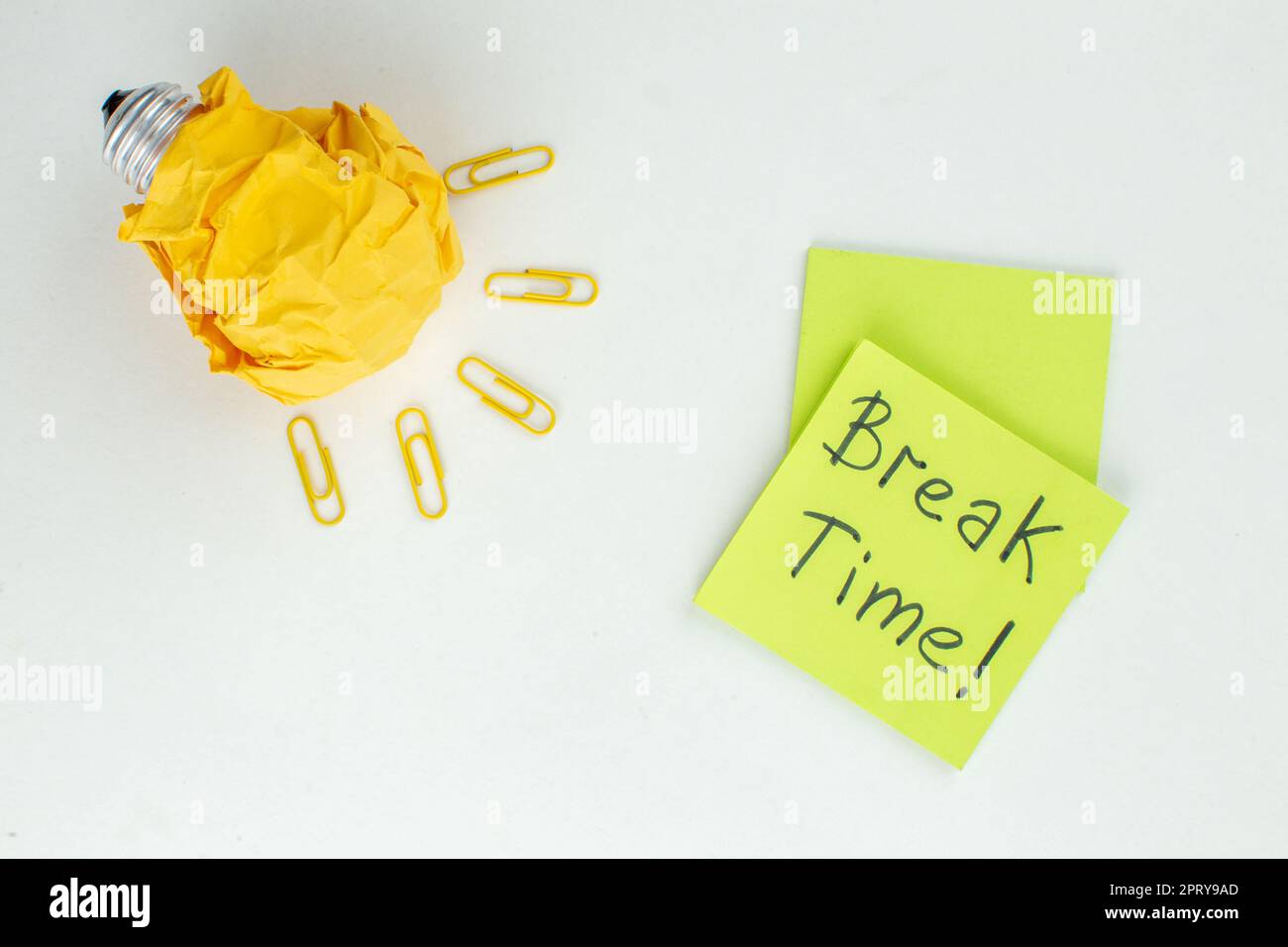 top view break time written on green sticky notes idealight bulb gem ...