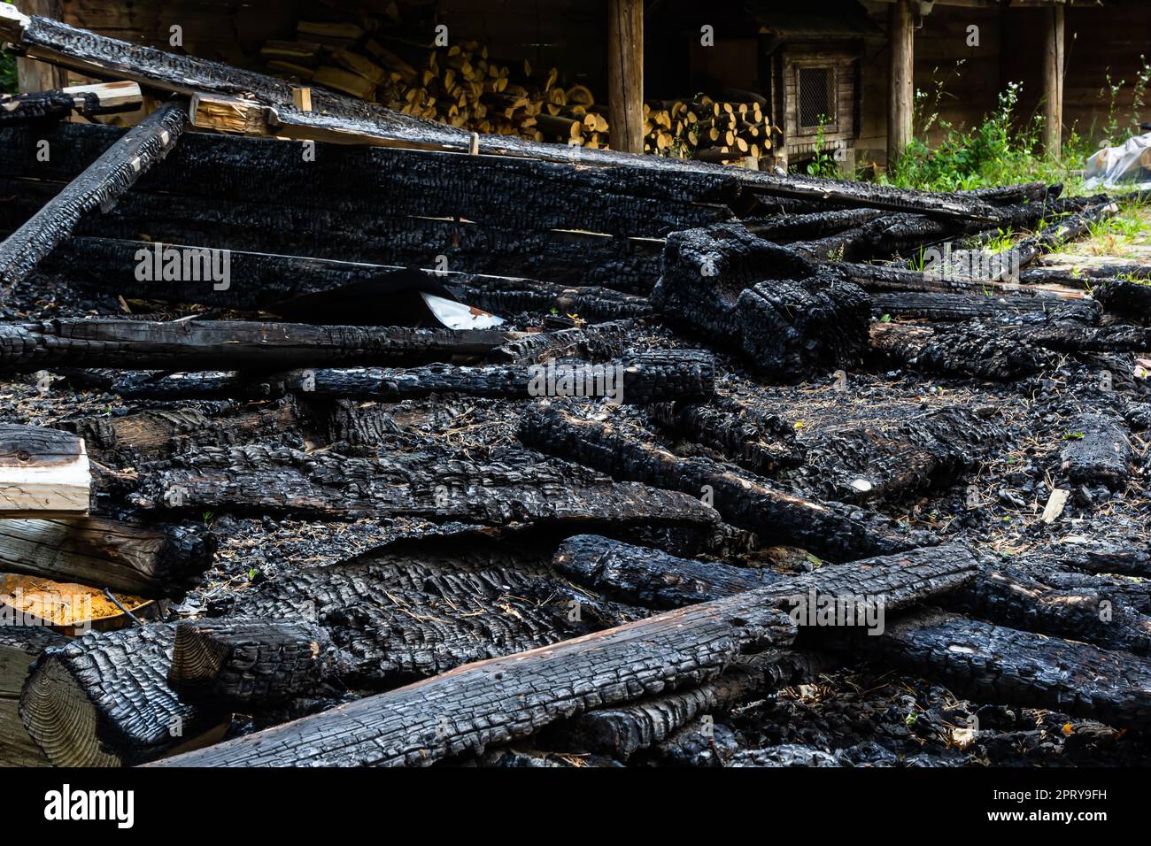 Destroyed by fire wooden house completely burned to the ground .ruins