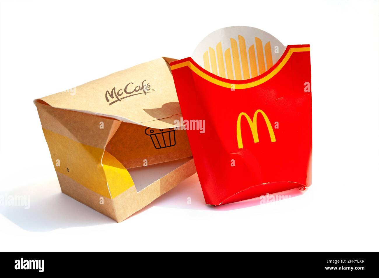 Ho Chi Minh City, Vietnam - April 20, 2023: Empty French fries and dessert paper boxes with McDonald's and McCafe logos isolated on white. Trash left Stock Photo