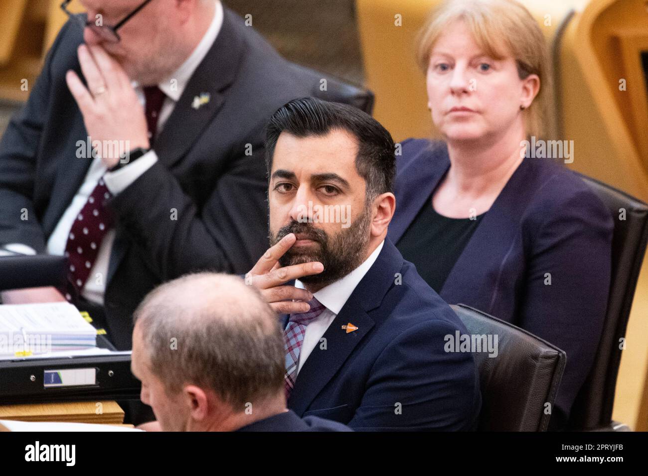 Edinburgh, Scotland, UK. 27th Apr, 2023. PICTURED: Humza Yousaf MSP, First Minister of Scotland and Leader of the Scottish National Party (SNP). Weekly session of First Ministers Questions as Humza Yousaf MSP, First Minister of Scotland takes questions in the chamber. Scenes also inside the corridor before and after FMQs. Credit: Colin Fisher/Alamy Live News Stock Photo