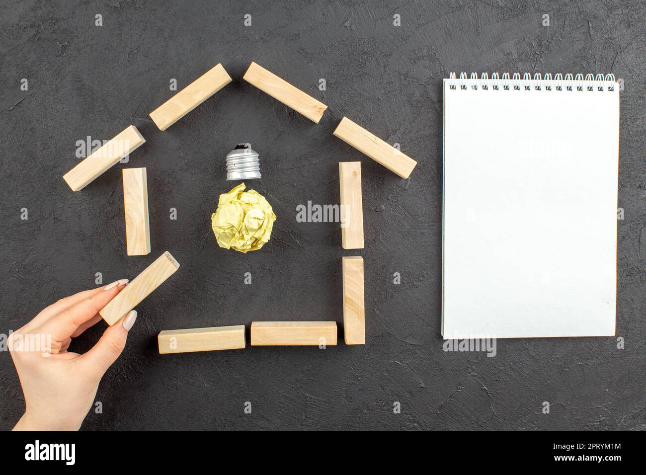 top view idealight bulb in house shaped wood blocks notepad wood block