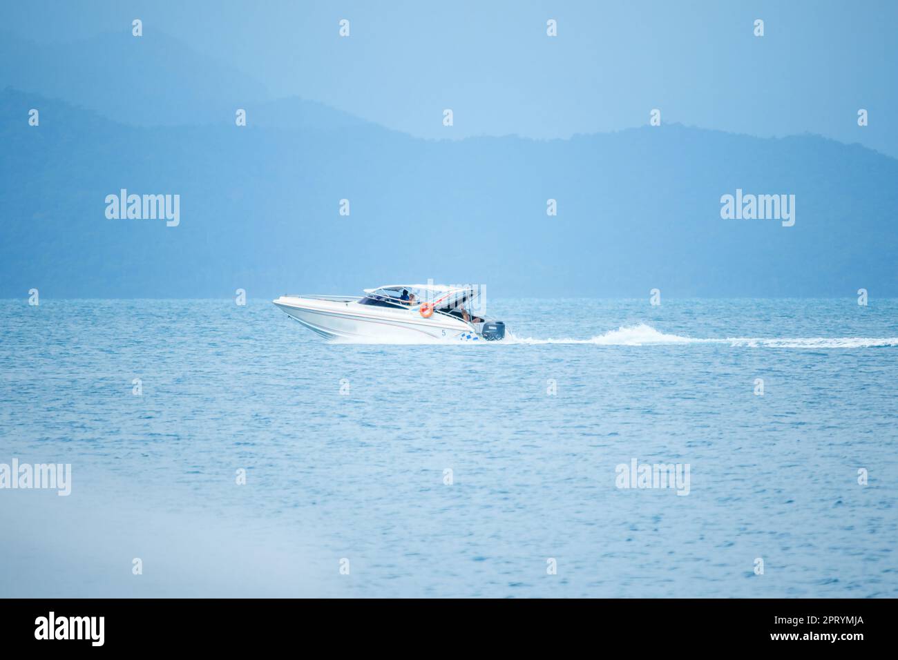 The white speed boat in the sea runs at speed Stock Photo - Alamy