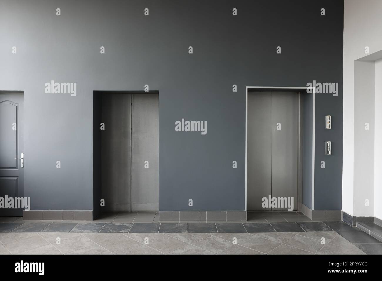 Closed stylish elevator doors in clean hall Stock Photo Alamy
