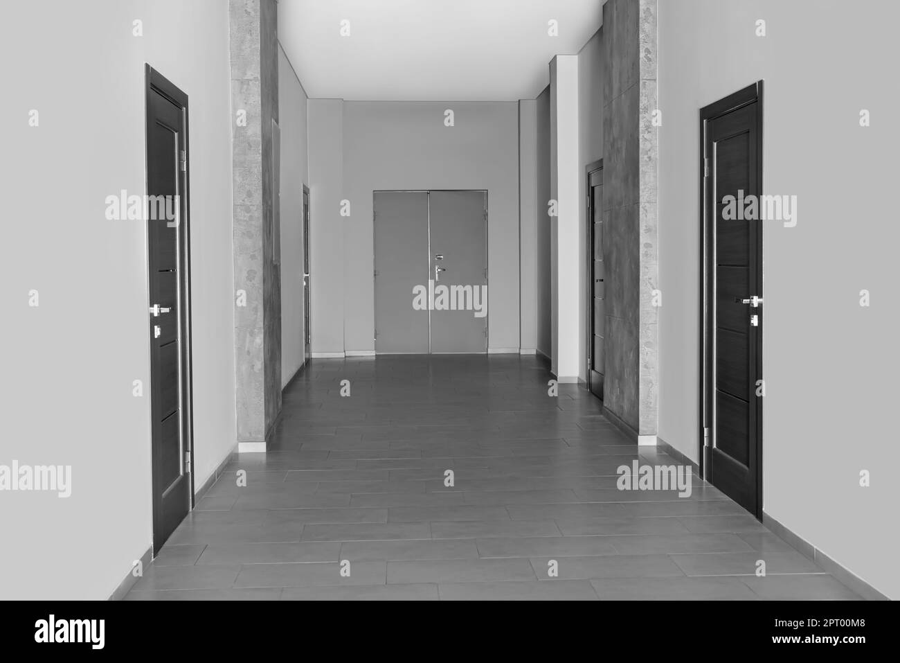 Empty office corridor with wooden doors. Interior design Stock Photo