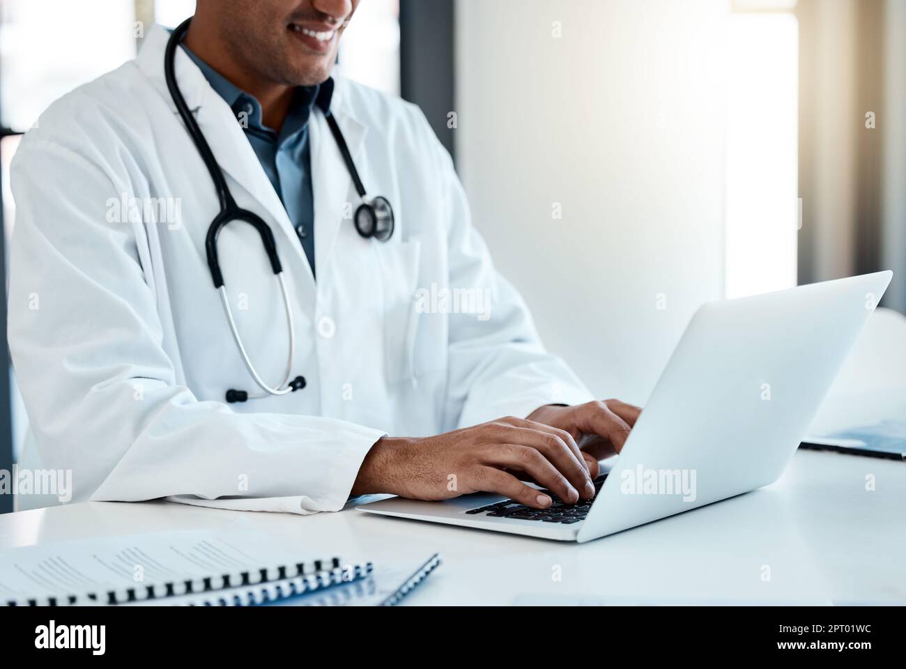 Doctor, laptop and typing email or online medical prescription for
