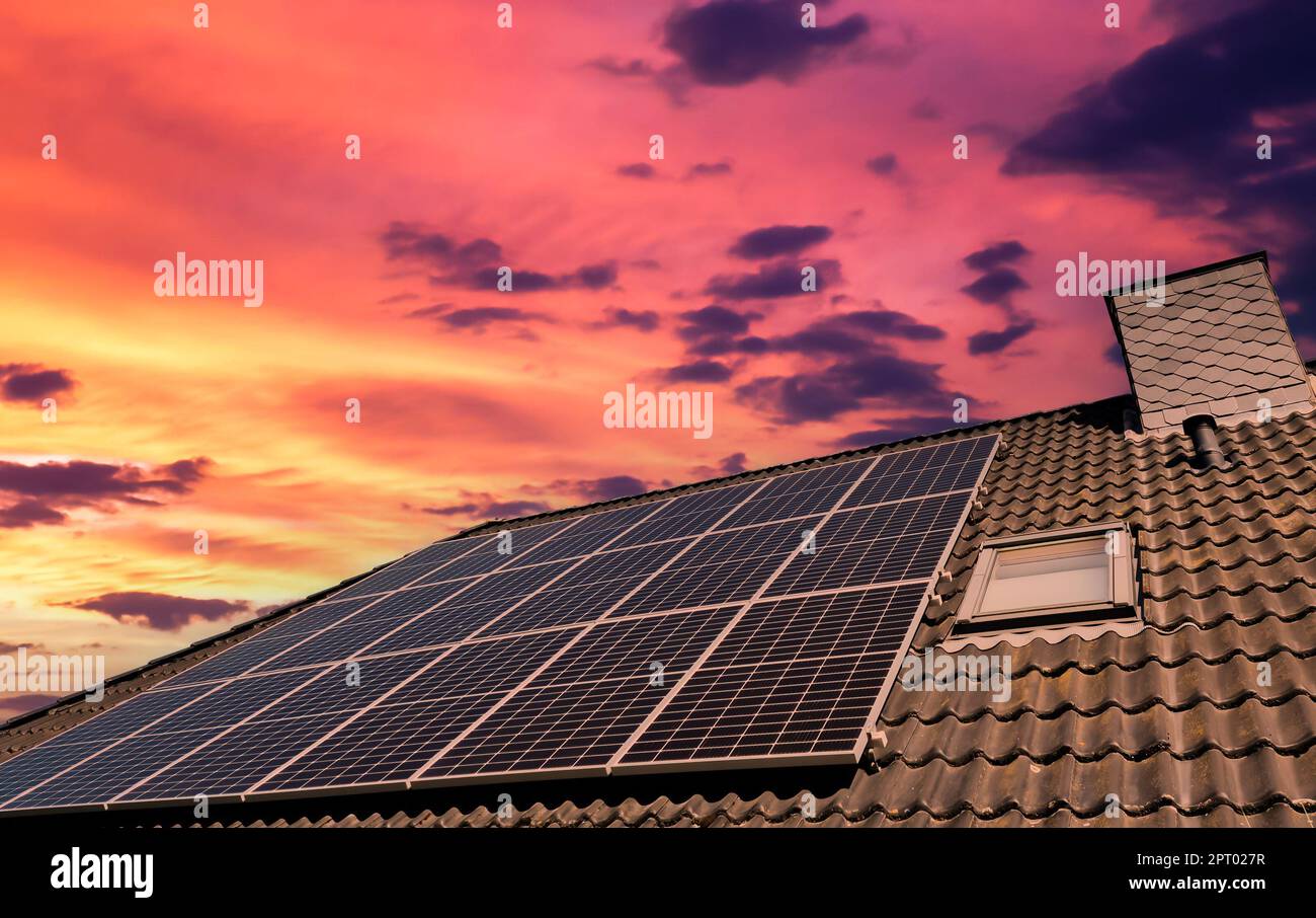 Solar panels producing clean energy on a roof of a residential house ...
