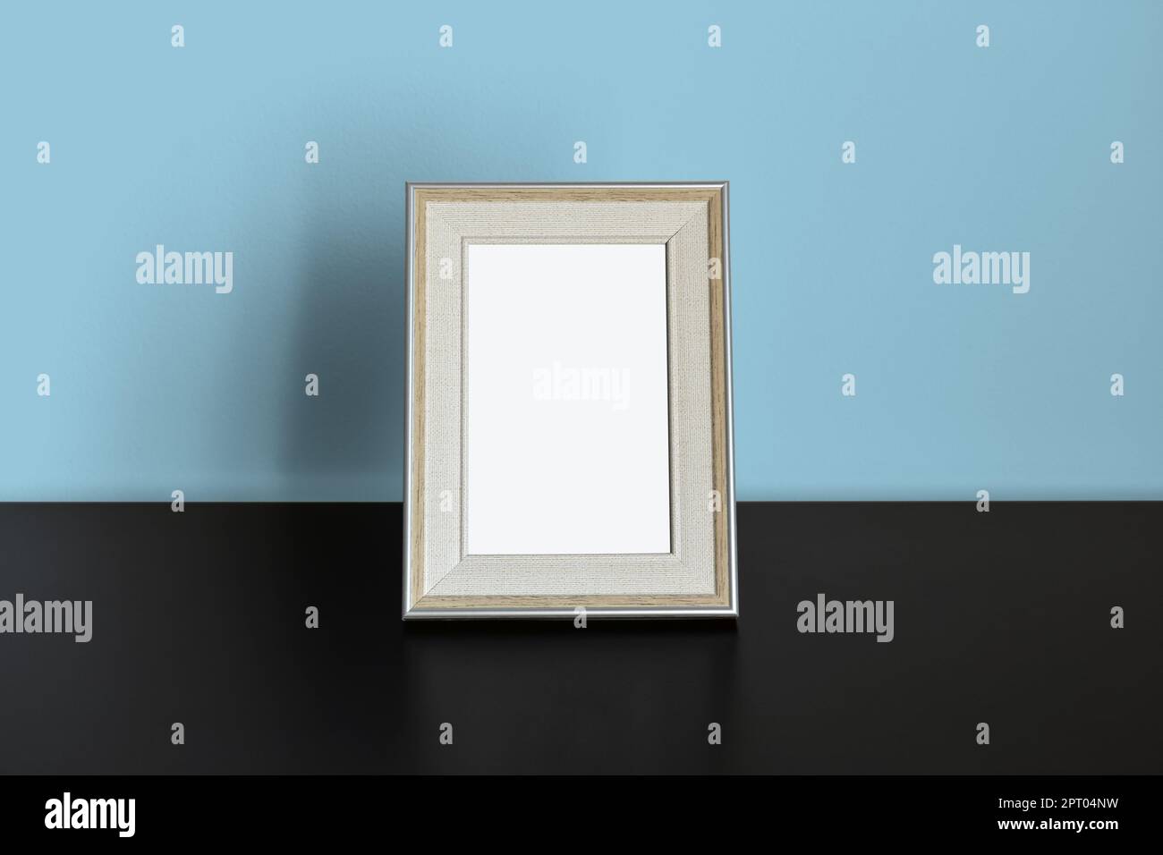 Picture Frame Mockup on Blue wall Stock Photo