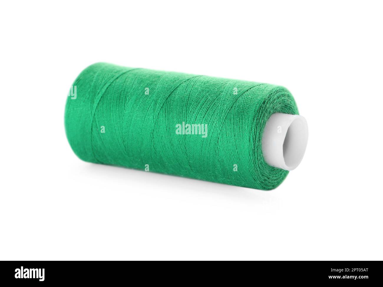 Spool of green sewing thread isolated on white Stock Photo