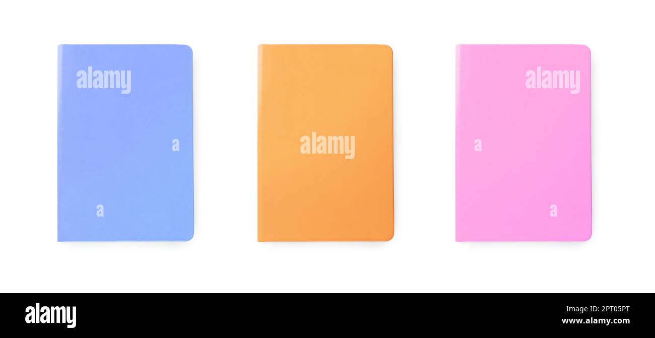 Set with multicolor notebooks on white background, top view. Banner design Stock Photo