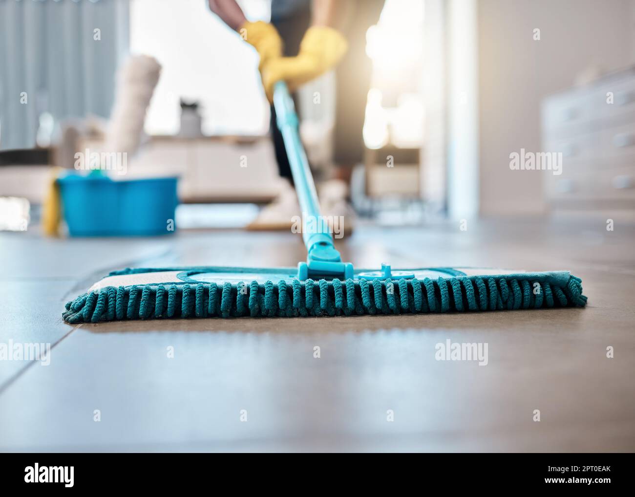 Man, mopping or cleaning floor in house, home or hospitality hotel for