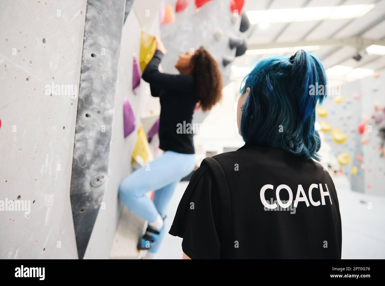 Personal Lesson Woman On Climbing Wall At Indoor Activity Centre Receiving Personal ...