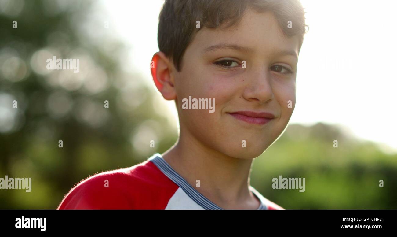 Thoughtful child boy thinking outside in sunlight. Pensive ...