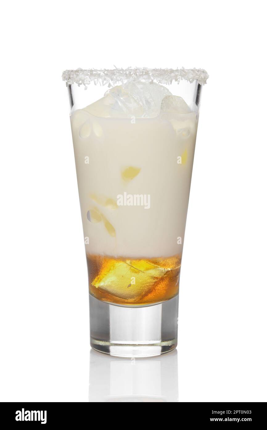 Coconut cream and rum cocktail in highball glass isolated on white