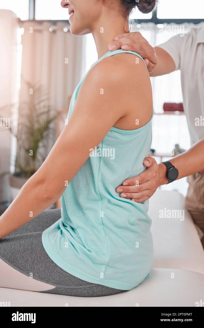 Chiropractor, physiotherapy and back pain of woman while at