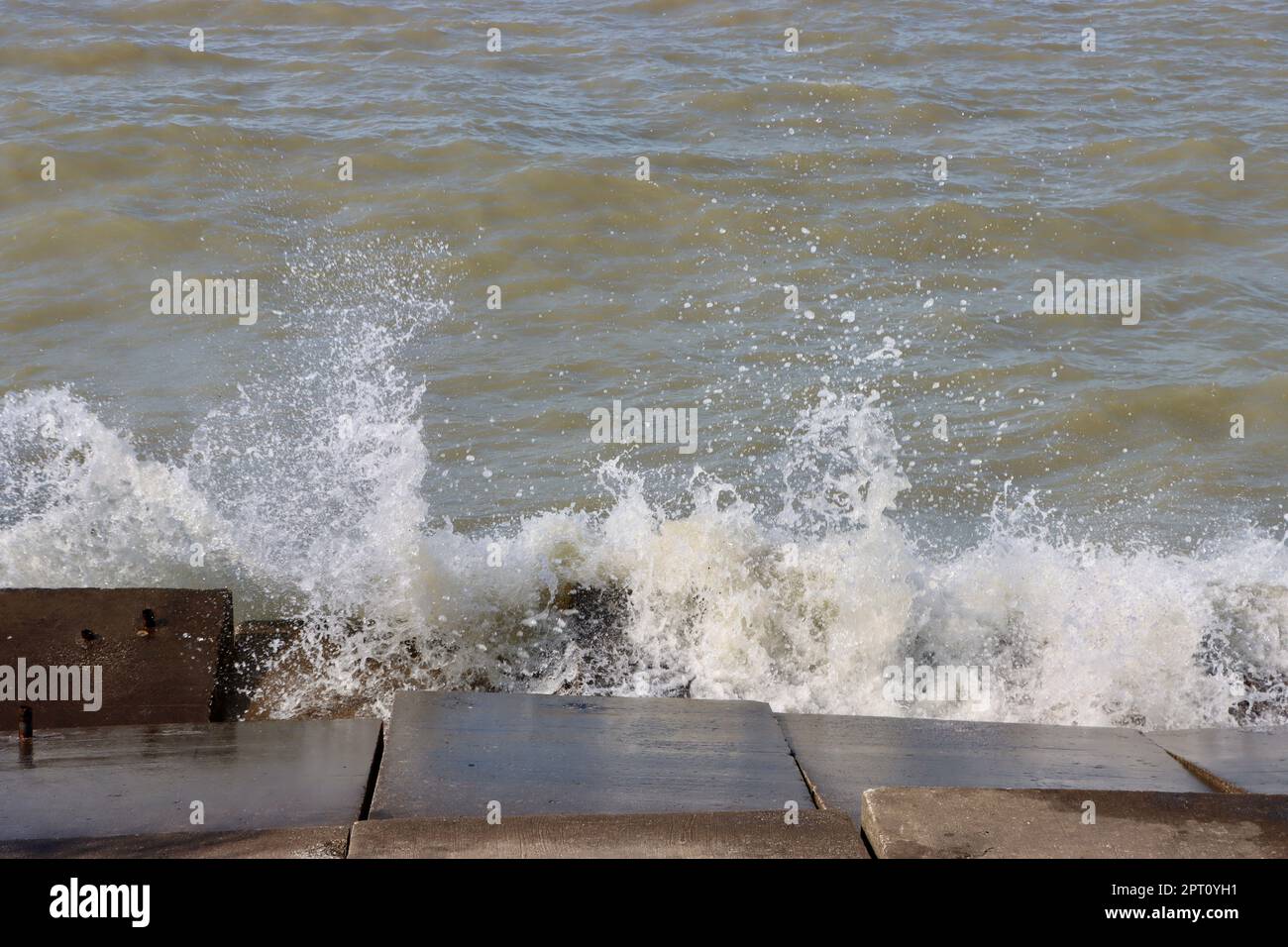 Coastline eroding Lake Erie waves hitting the shore at Lakewood Park west of City of Cleveland, Ohio Stock Photo