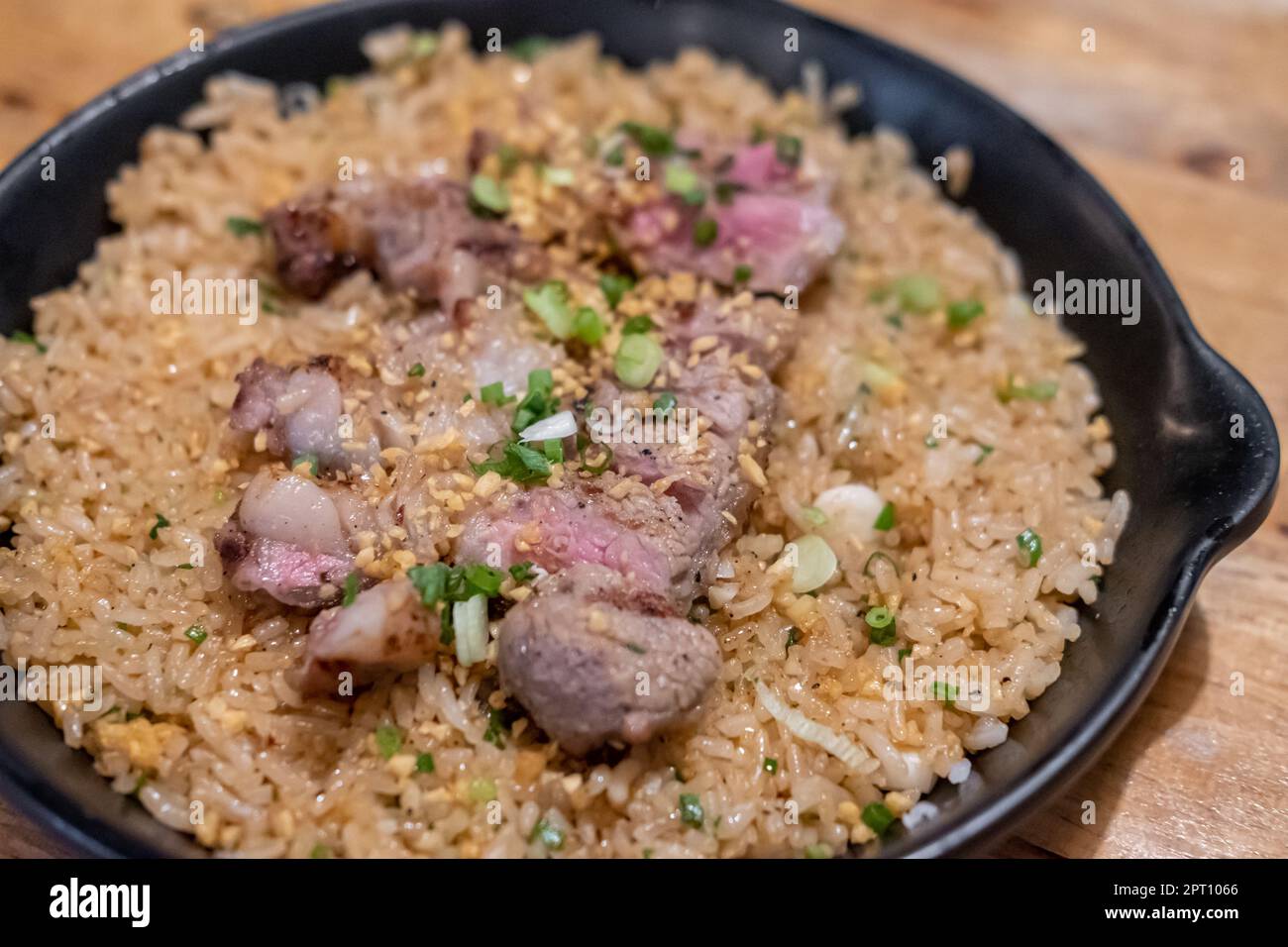 Beef with garlic fried rice, a Japanese dish consisting of a bowl of ...