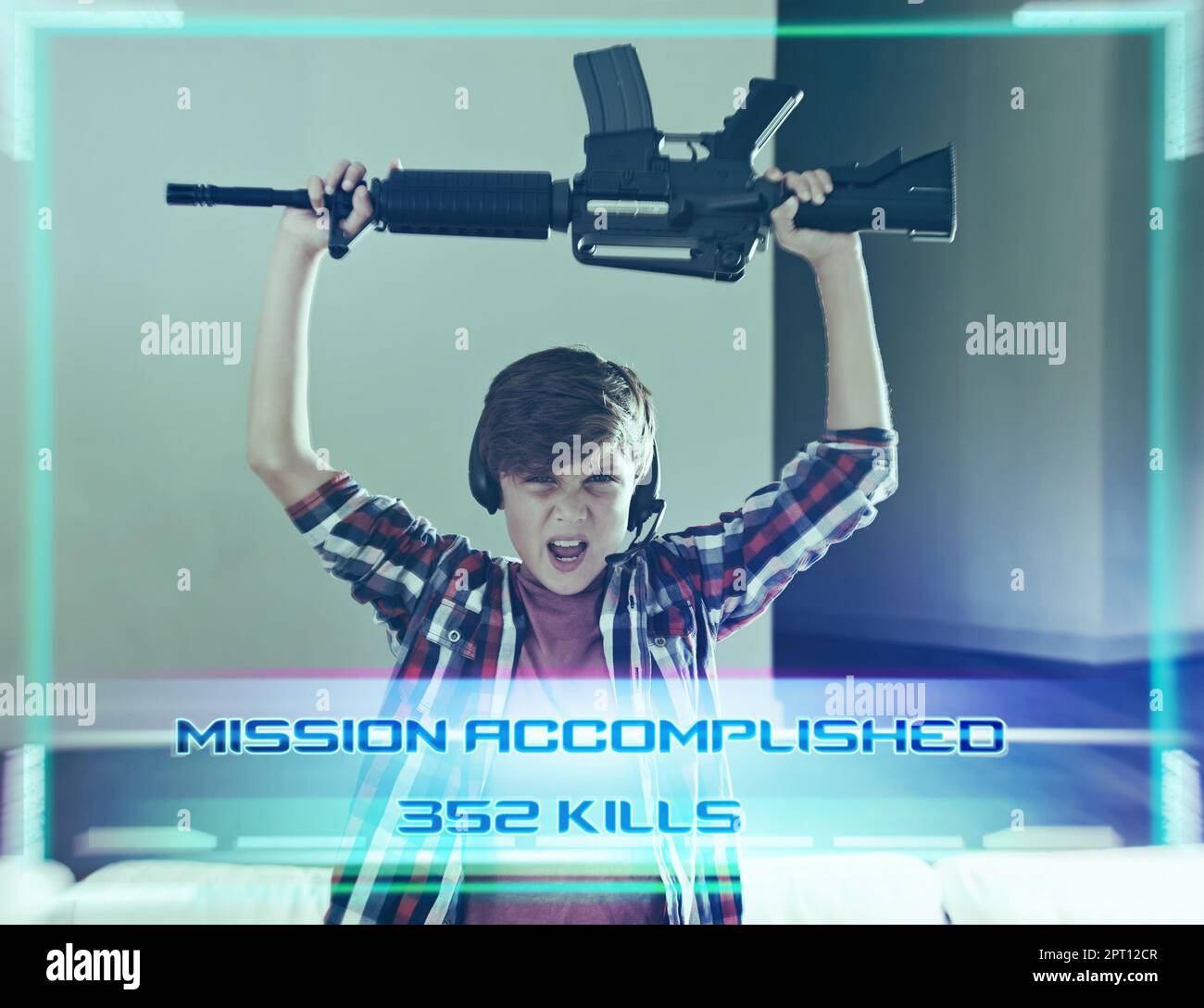 Mission accomplished.a young boy celebrating completing his video game Stock Photo