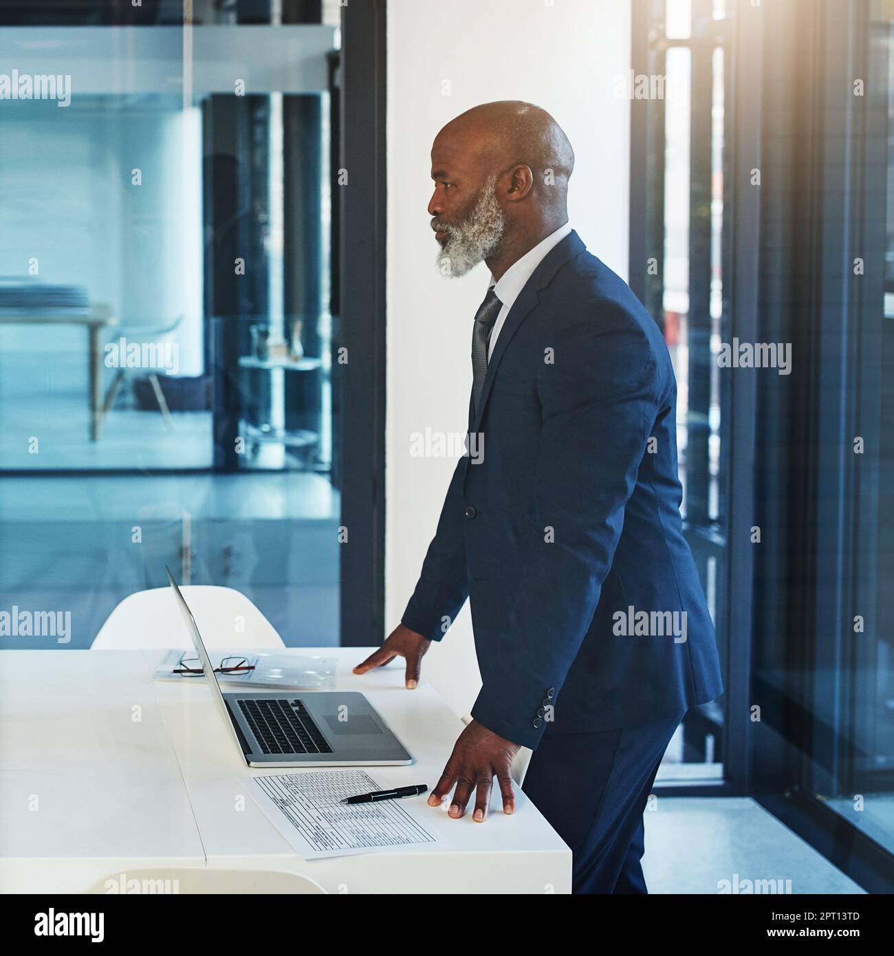 Envisioning a clear path to huge success. a mature businessman working ...