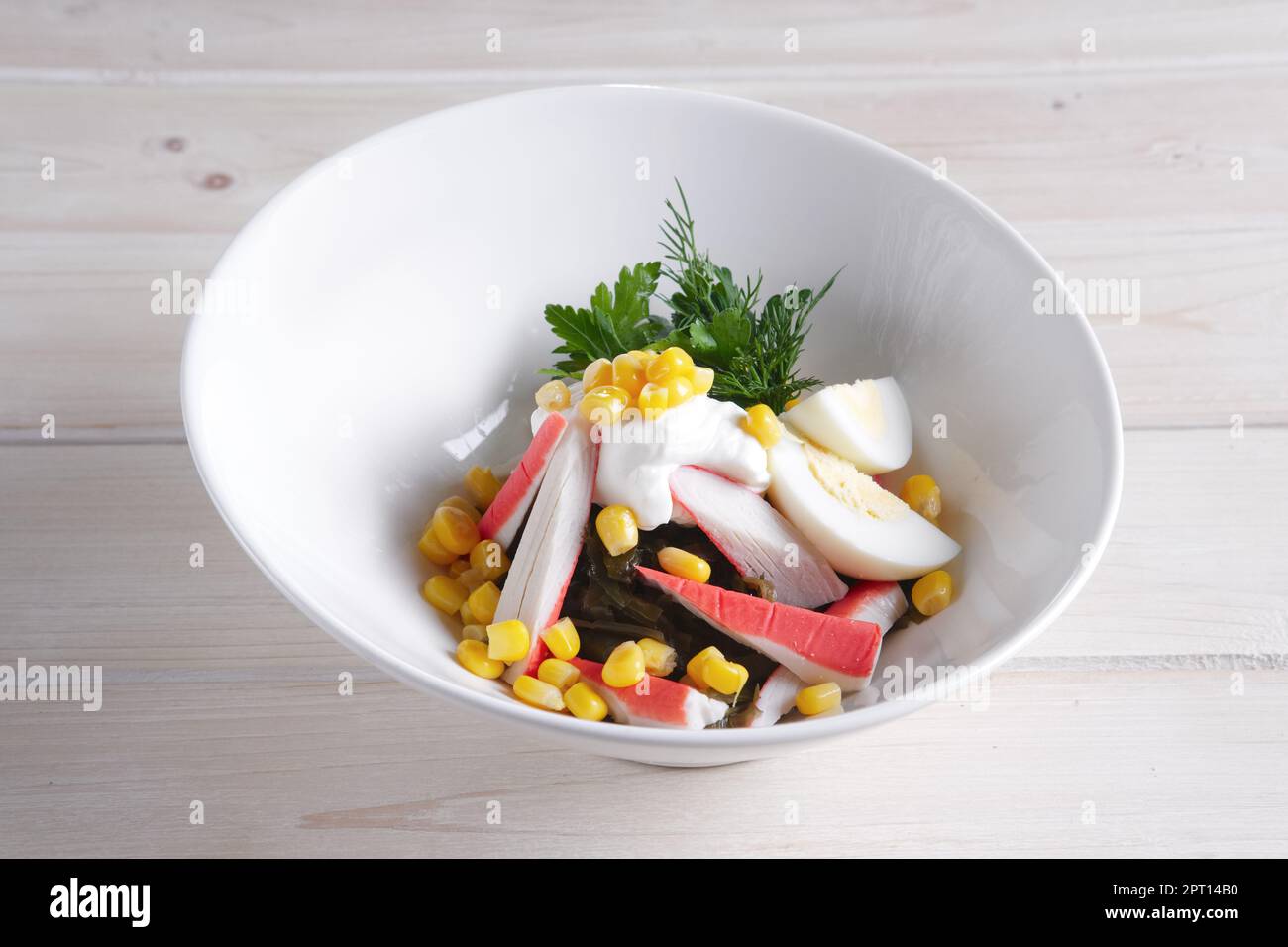 Salad with sea kale, crab meat, egg, corn and mayonnaise Stock Photo Alamy