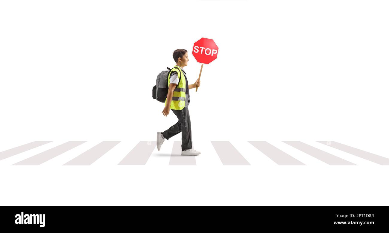 Full length profile shot of a schoolboy wearing a reflective vest and