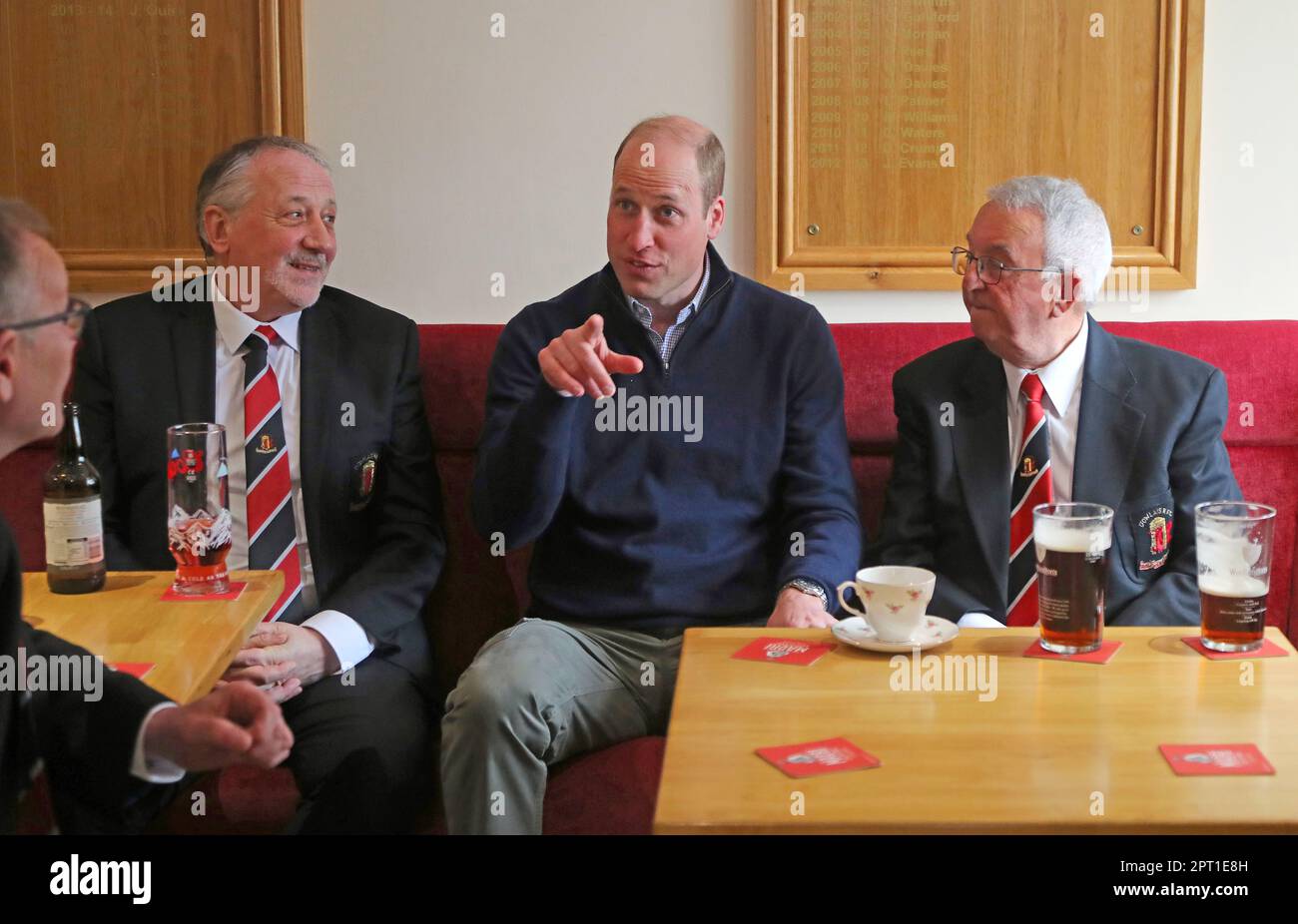 The Prince of Wales talks with members of Dowlais Rugby Club, during a visit to the club near Merthyr Tydfil in Wales. The volunteer-run organisation, which covers the central area of the Bannau Brycheiniog National Park including Pen y Fan, is celebrating its 60th birthday. Picture date: Thursday April 27, 2023. Stock Photo