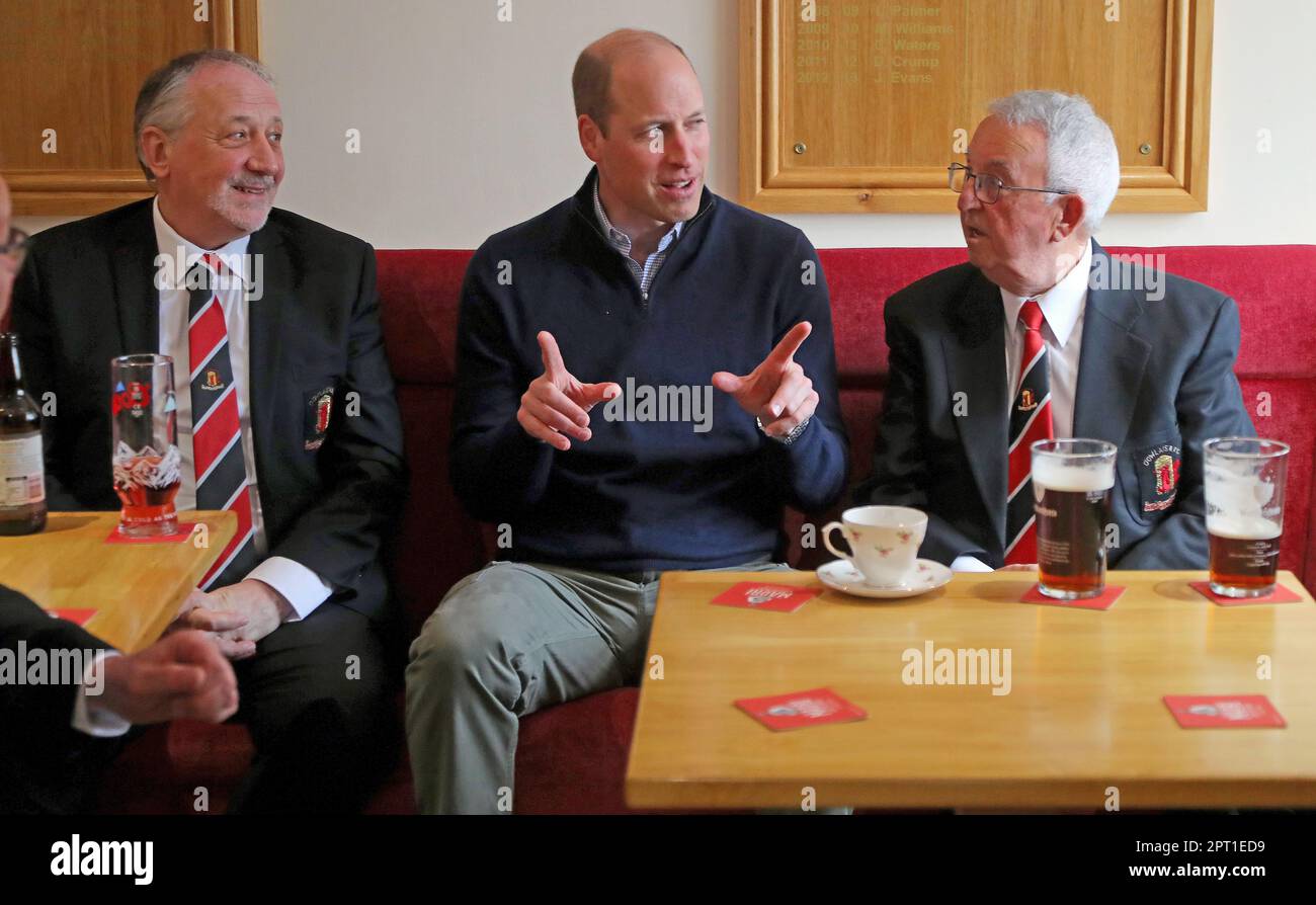 The Prince of Wales talks with members of Dowlais Rugby Club, during a visit to the club near Merthyr Tydfil in Wales. The volunteer-run organisation, which covers the central area of the Bannau Brycheiniog National Park including Pen y Fan, is celebrating its 60th birthday. Picture date: Thursday April 27, 2023. Stock Photo