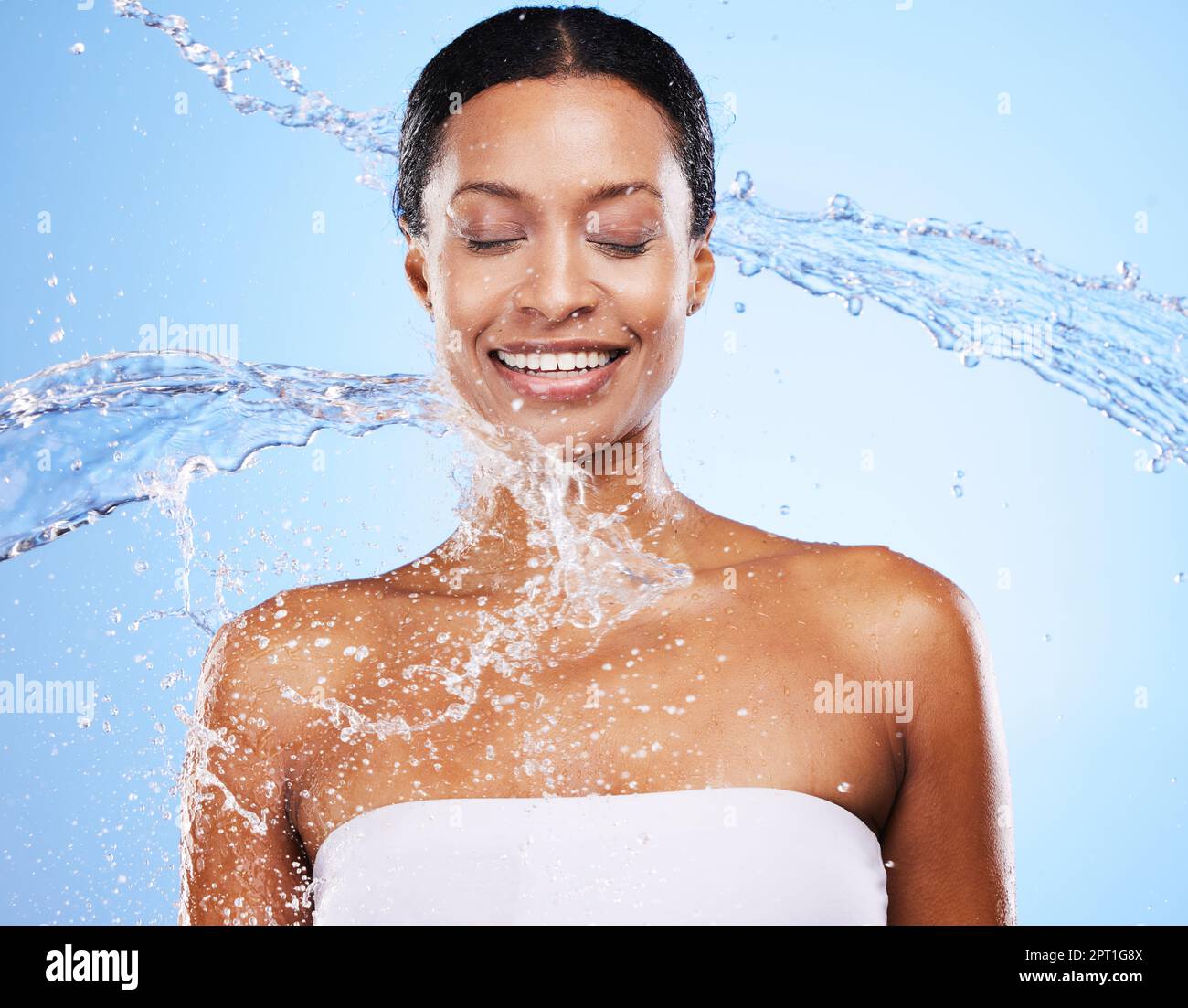 Woman, water splash and shower with body cleaning and smile with