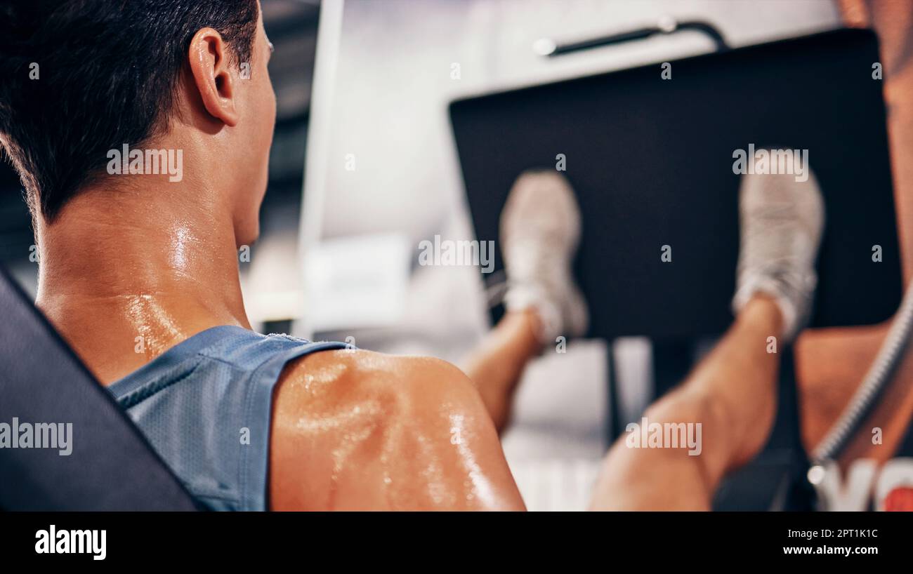 Fitness, man sweating using leg press for workout, health and wellness