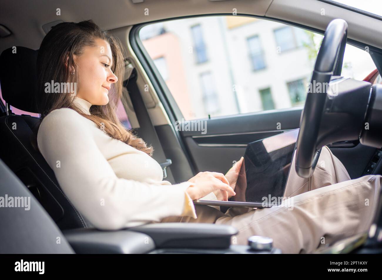 Woman sitting behind steering wheel hi-res stock photography and images ...