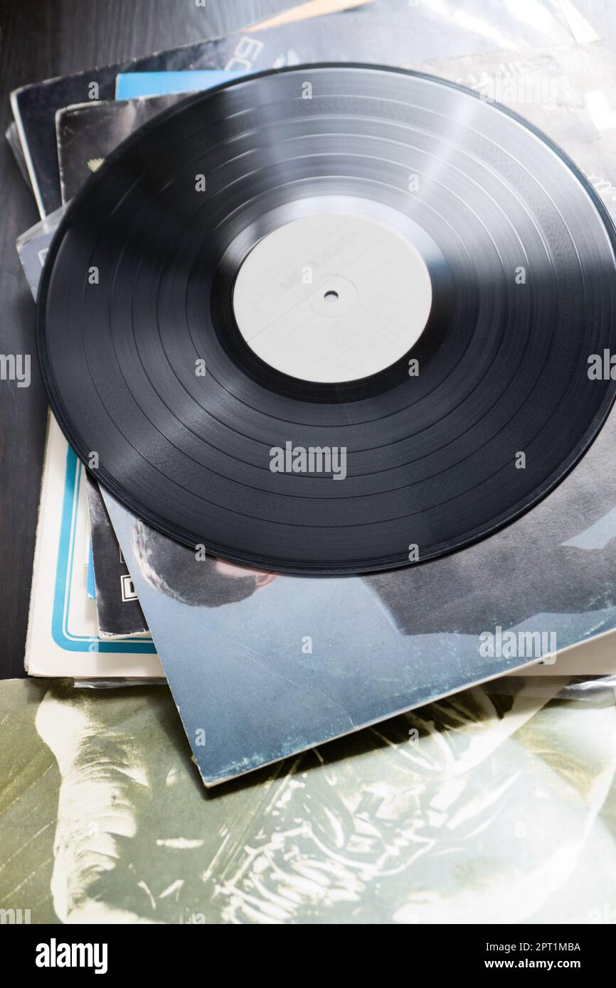 Vinyl recording disk and different albums with plates Stock Photo Alamy