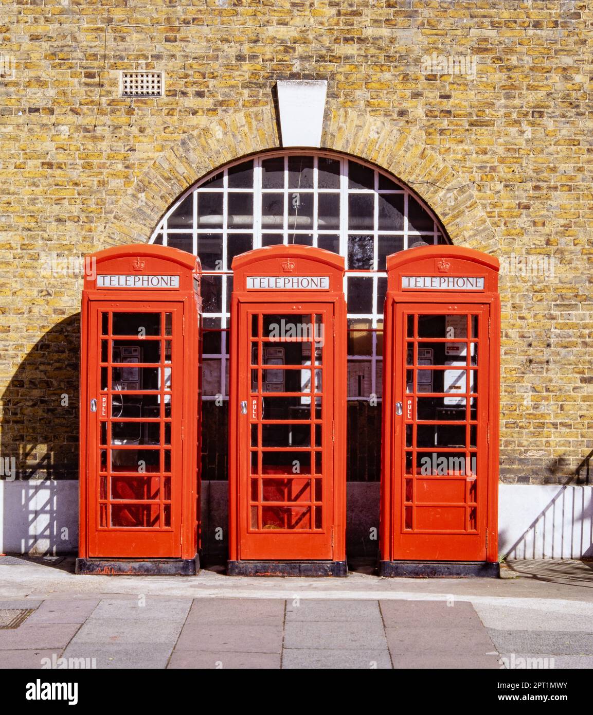 3 phone phone boxes outside Gravesend post office in the early 1990s Stock Photo