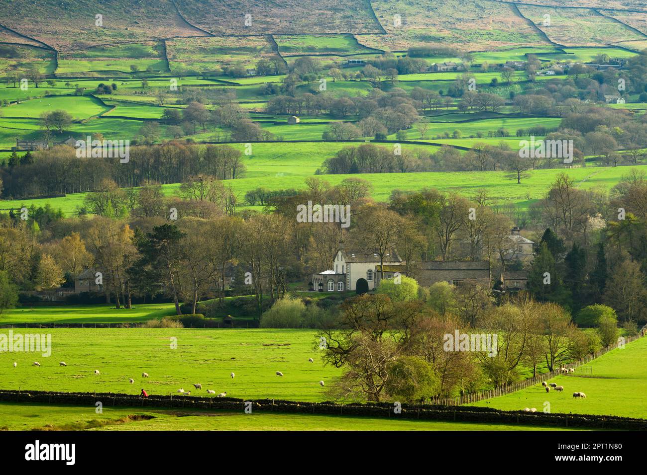 Beautiful sunny valley & edge of village houses (sunlit hill & hillside, isolated buildings, upland fells) - Addingham, West Yorkshire, England, UK. Stock Photo