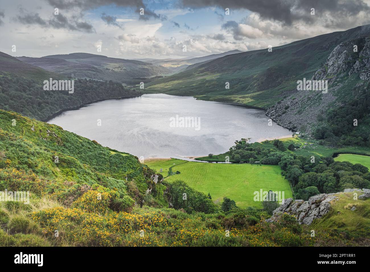 Dramatic sky over Lough Tay called The Guinness Lake in deep