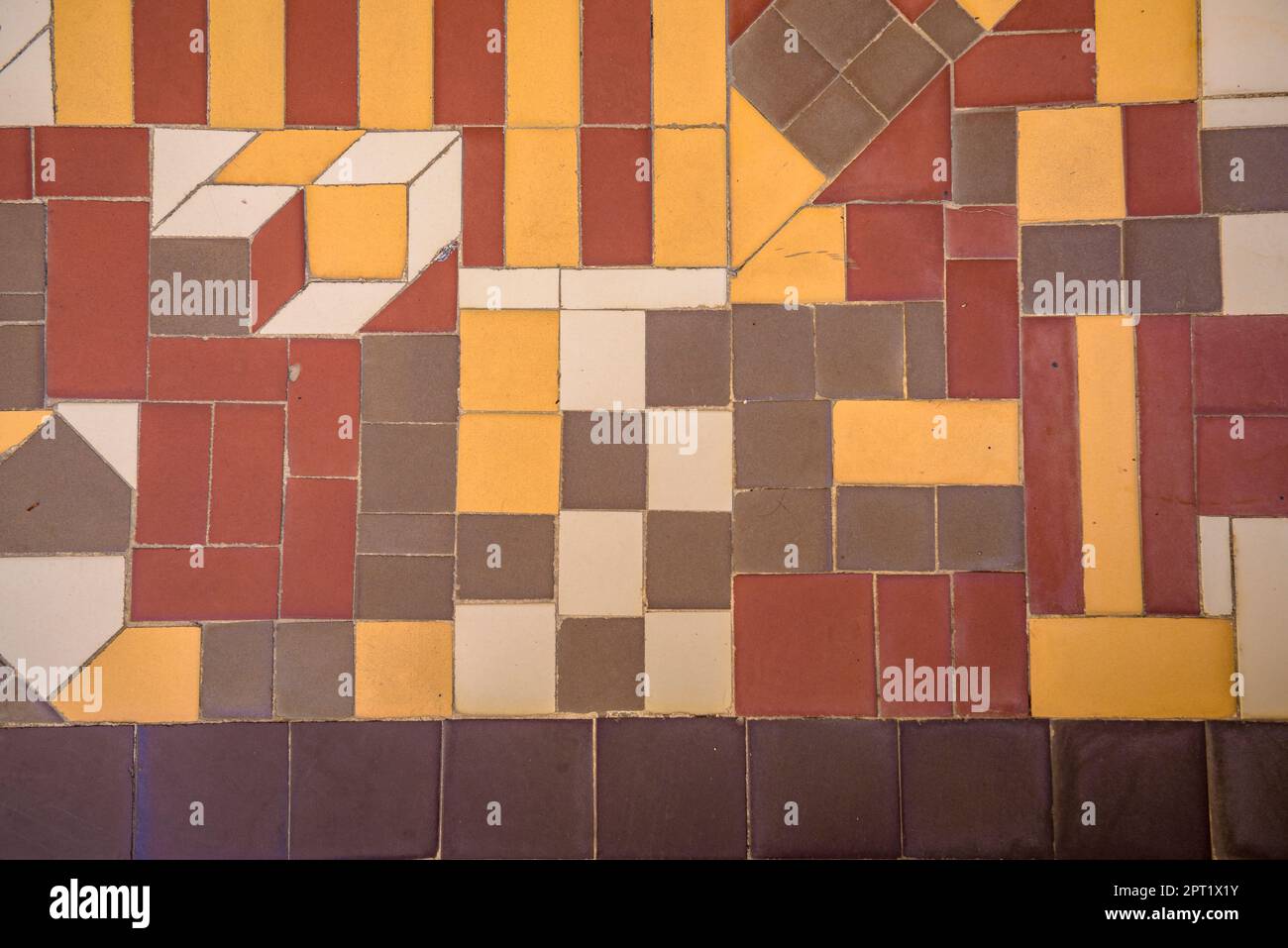 Mosaic floor in the backyard of Casa Batlló with a detail of the Catalan flag (Barcelona, Catalonia, Spain) ESP Suelo con mosaico en el patio C.Batlló Stock Photo